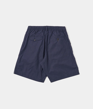 UNIVERSAL WORKS SHORT PLISSÉ TRACK 34151 POPELINE PEACHED NAVY - Shoelosophy