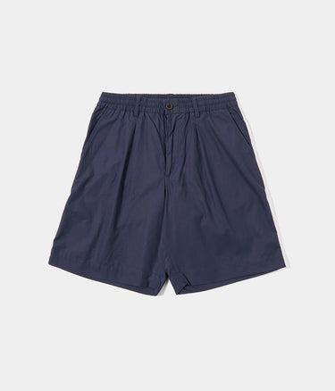 UNIVERSAL WORKS PLEATED TRACK SHORT 34151 PEACHED POPLIN NAVY