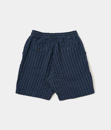 UNIVERSAL WORKS PLEATDED TRACK SHORT CHESTER STRIPE P34002 NAVY